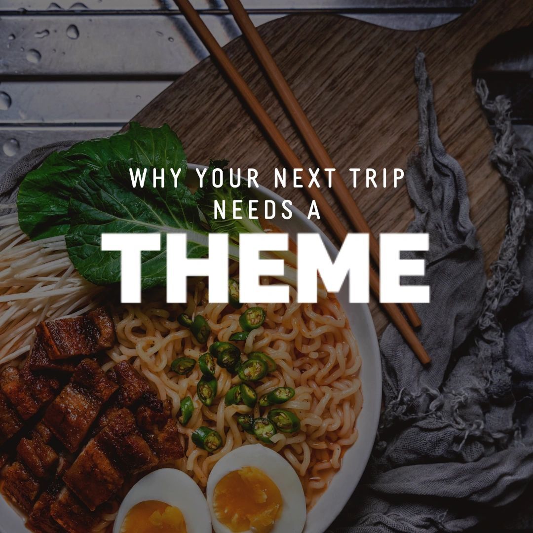 A bowl of asian noodles with toppings and the text "why your next trip needs a theme" overlayed.