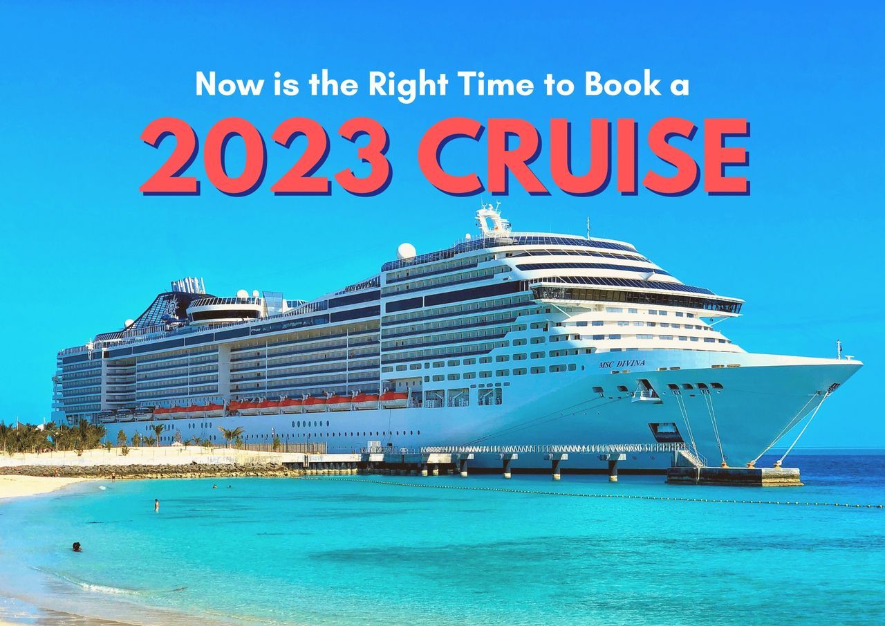 Large cruise ship docked at a tropical destination with an advertisement for booking cruises in 2023.