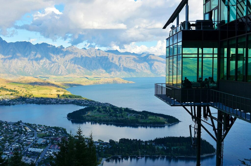 A lodge terrace overlooking a lake and mountains in New Zealand