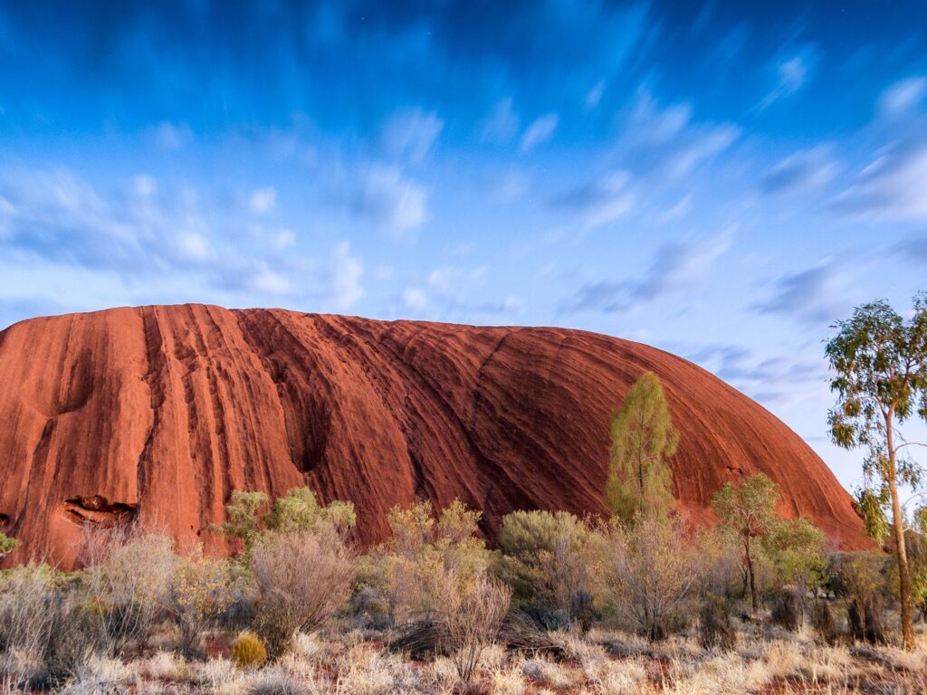 Uluru glowing red in Australia’s Outback