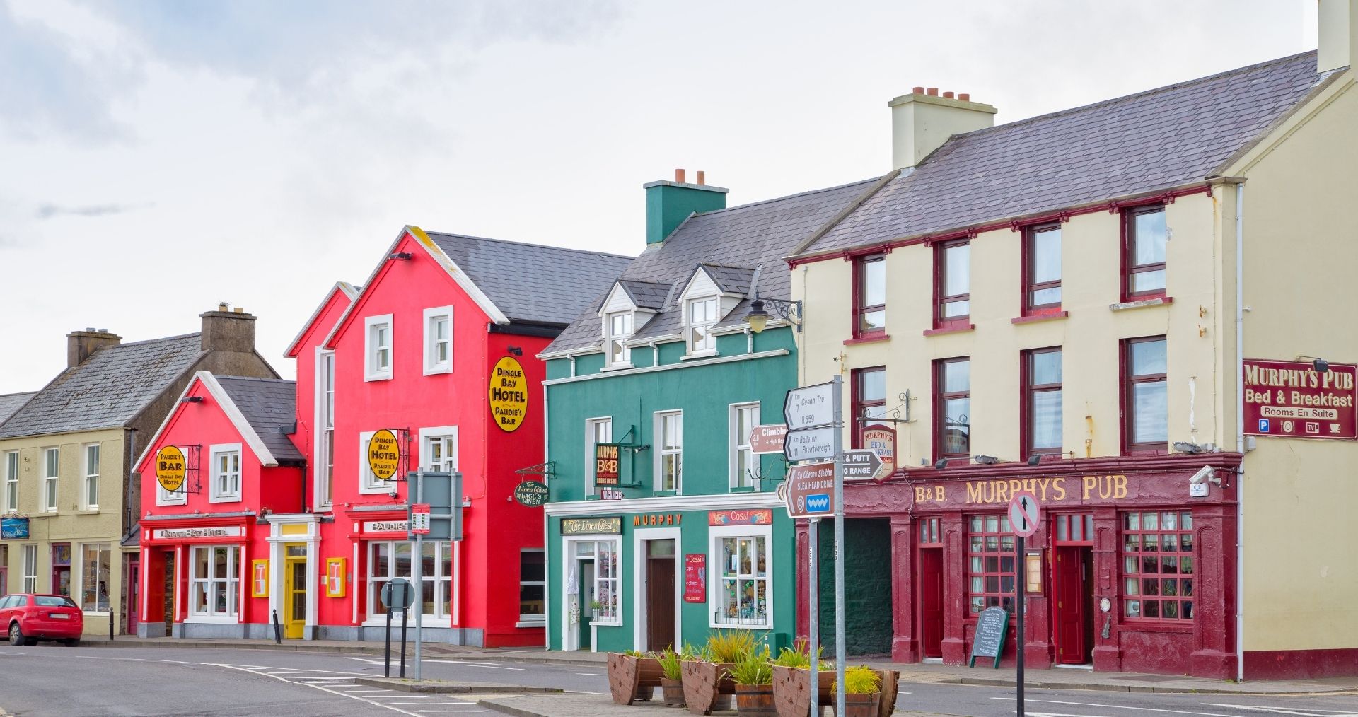 Brightly painted shopfronts on a street in Dingle, County Kerry