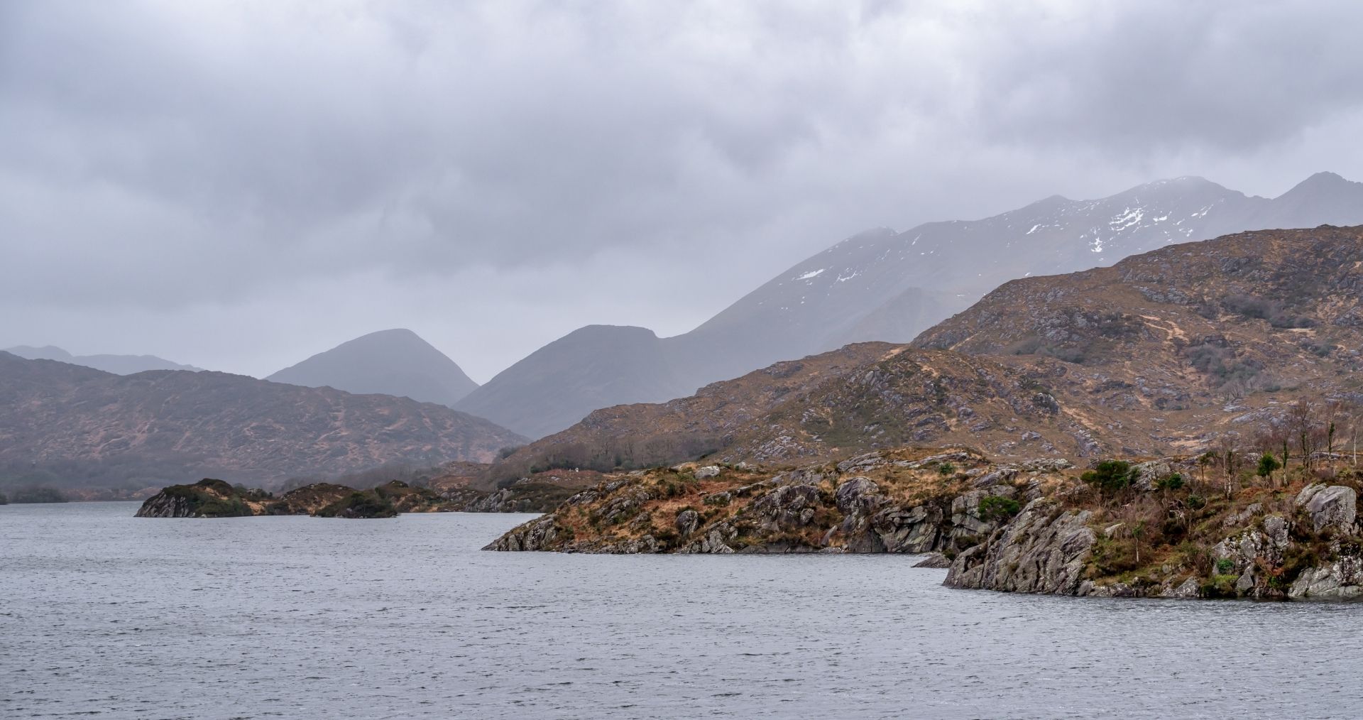 The Upper Lake of Killarney beneath misty mountains