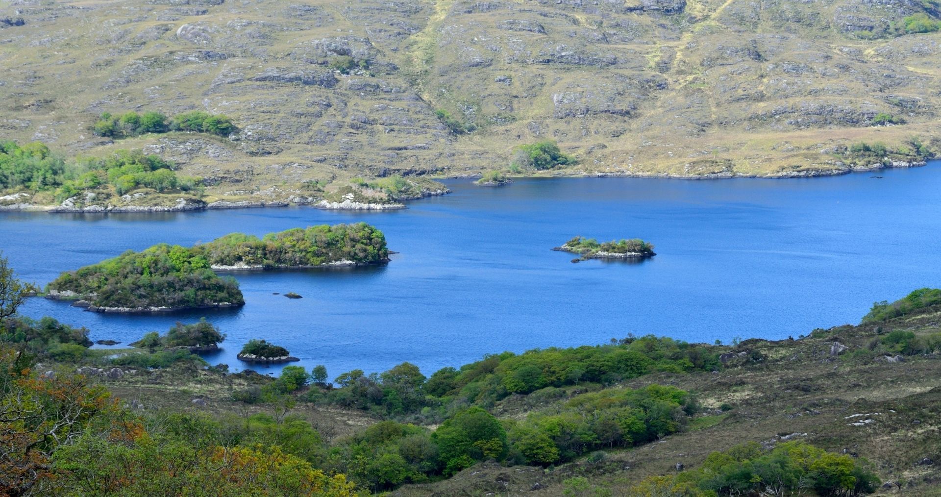 The upper lakes of Killarney surrounded by mountains in County Kerry