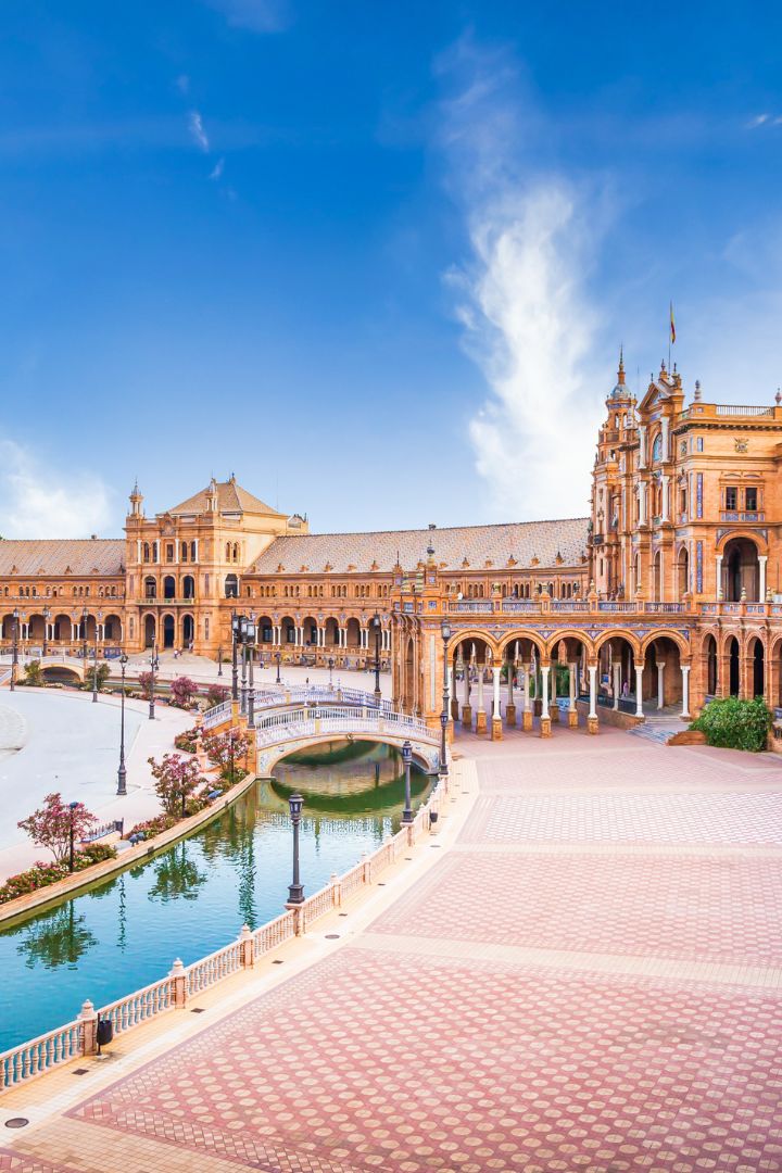 The tiled bridges and canal of Plaza de España in Seville