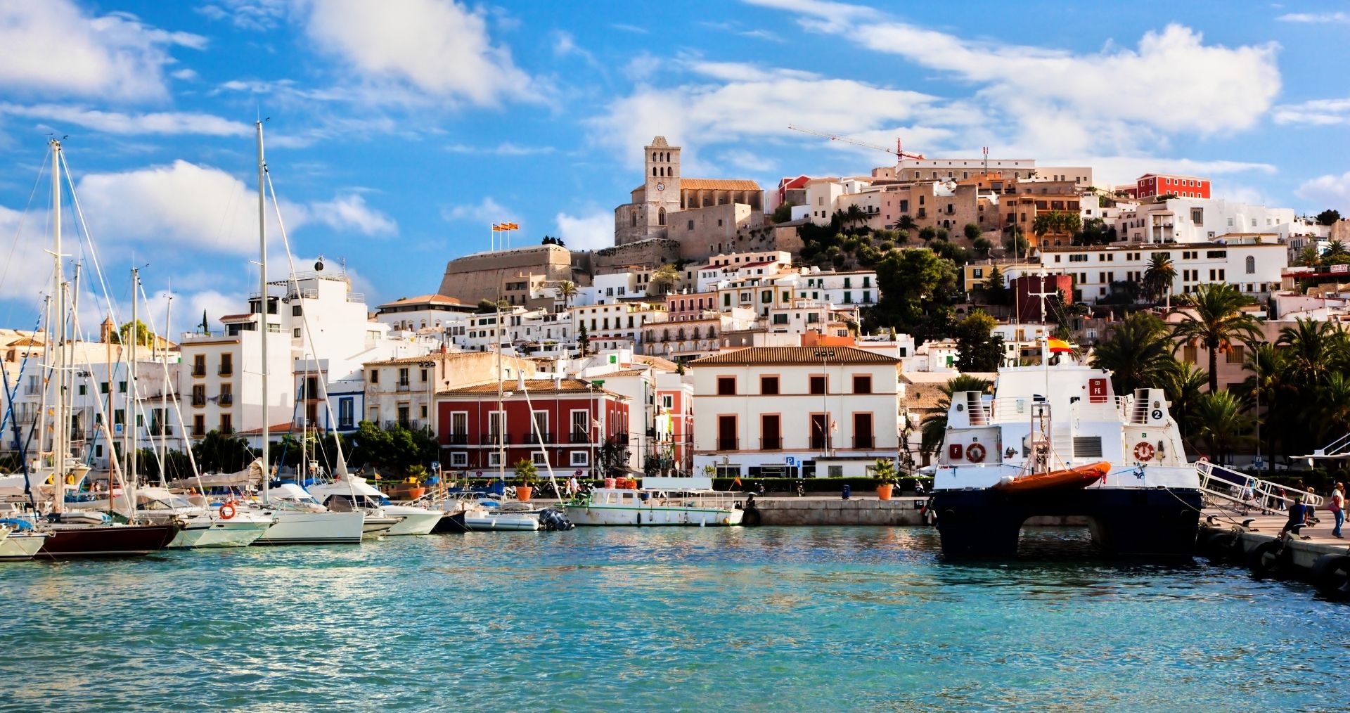 Ibiza Town’s harbor with the walled old town of Dalt Vila above