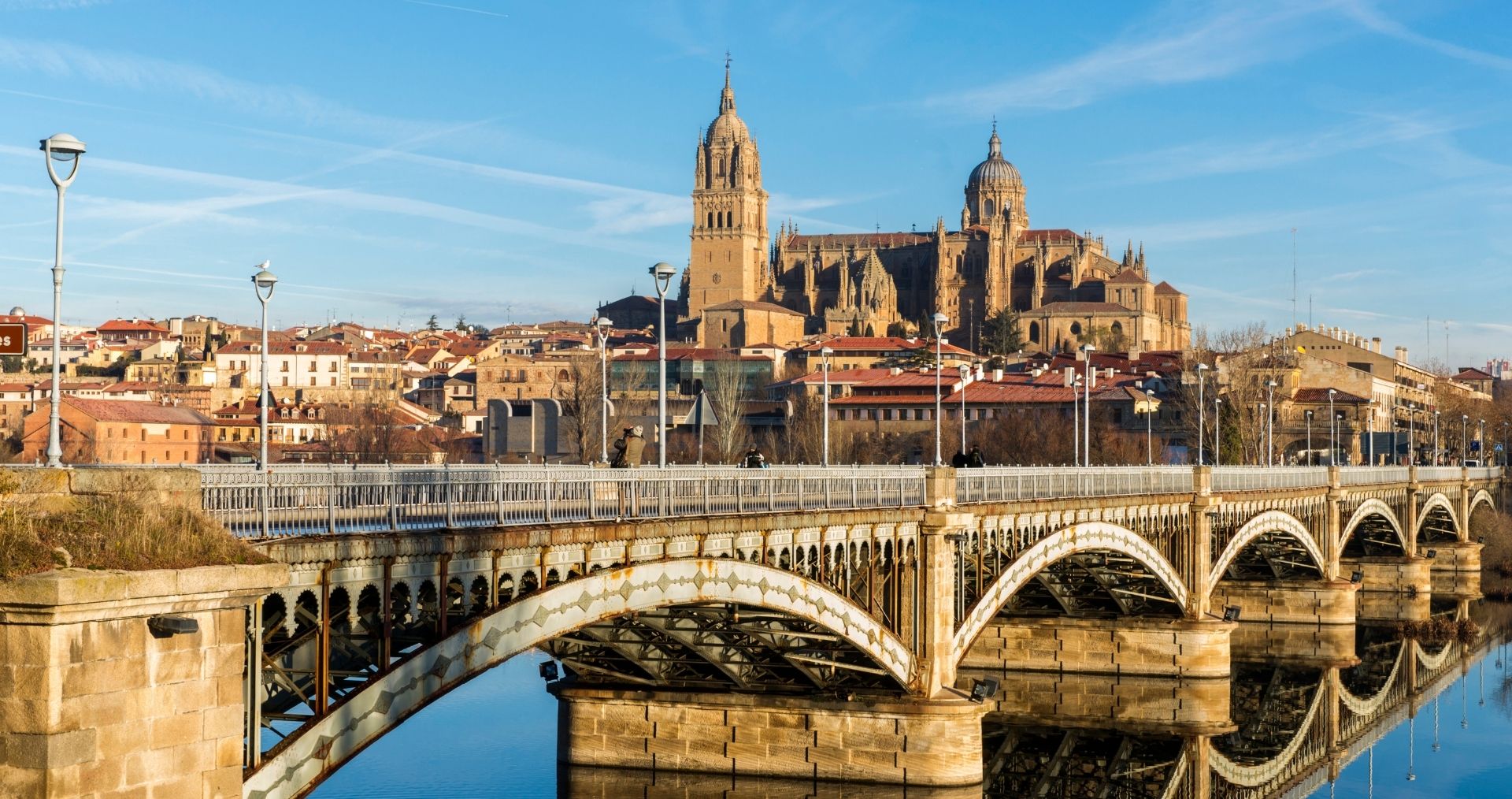 Salamanca’s cathedral and old town above a stone bridge over the river