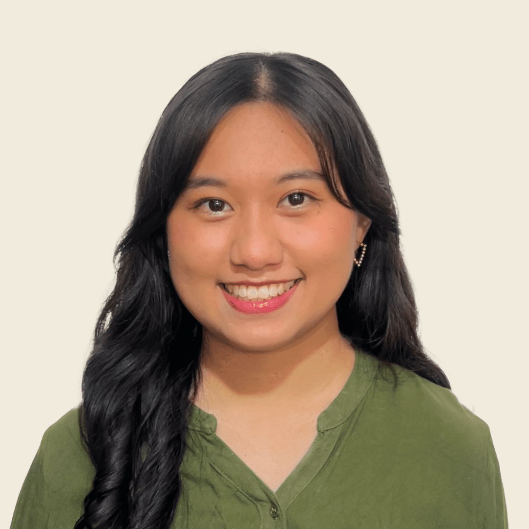 a woman with long hair smiling