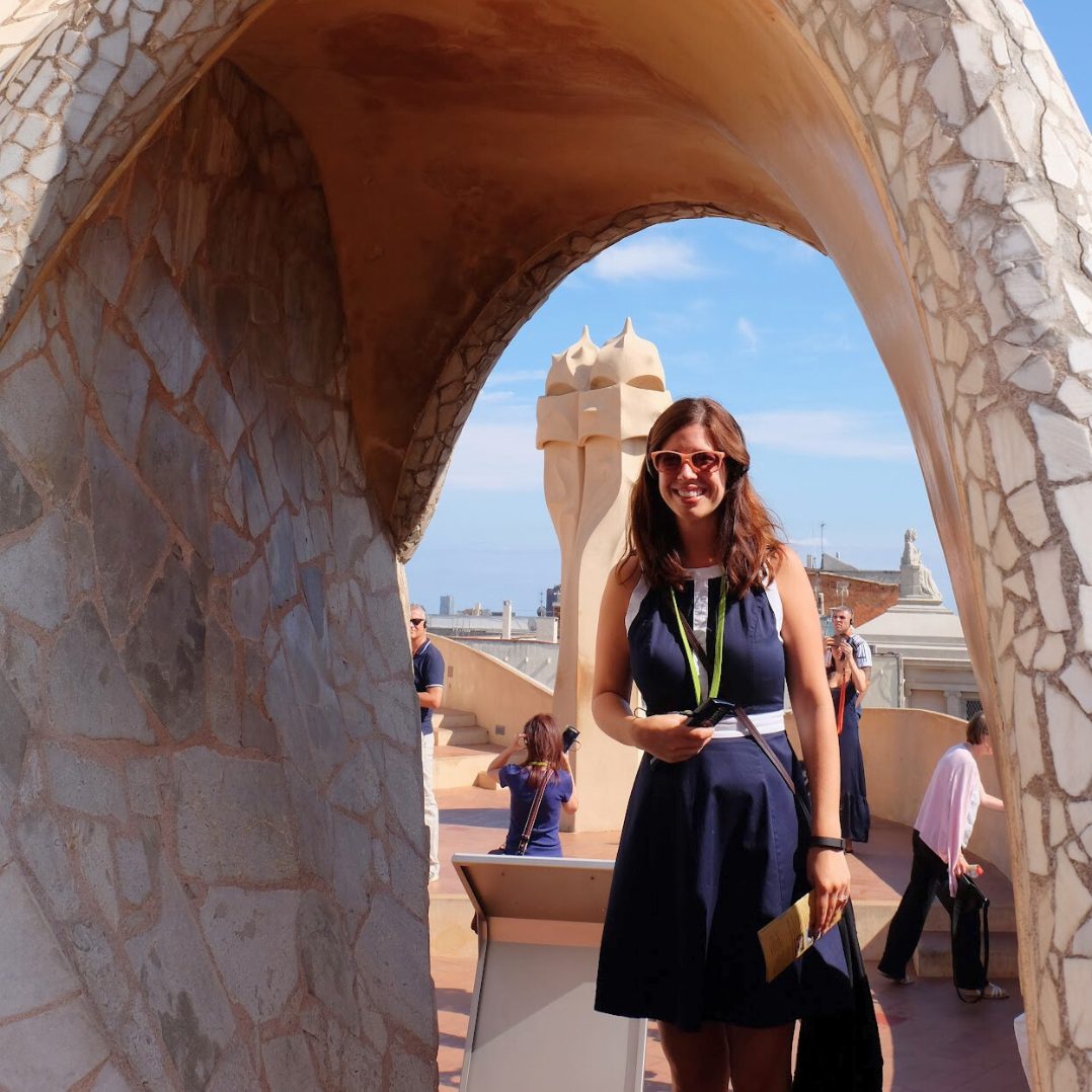 A Travel Byrds advisor beneath one of Gaudí’s white mosaic arches in Barcelona