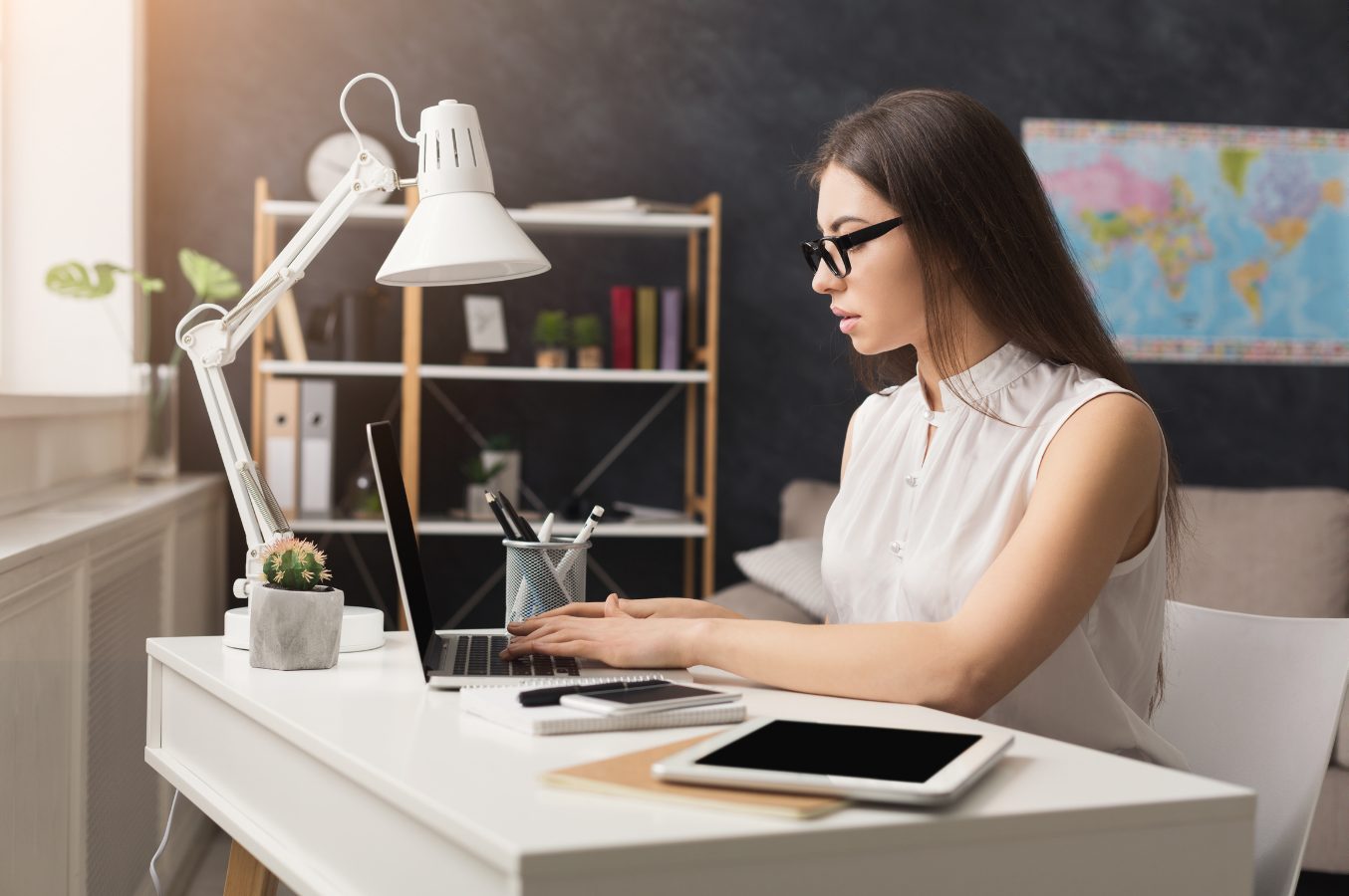 Travel advisor reviewing trip options at her desk