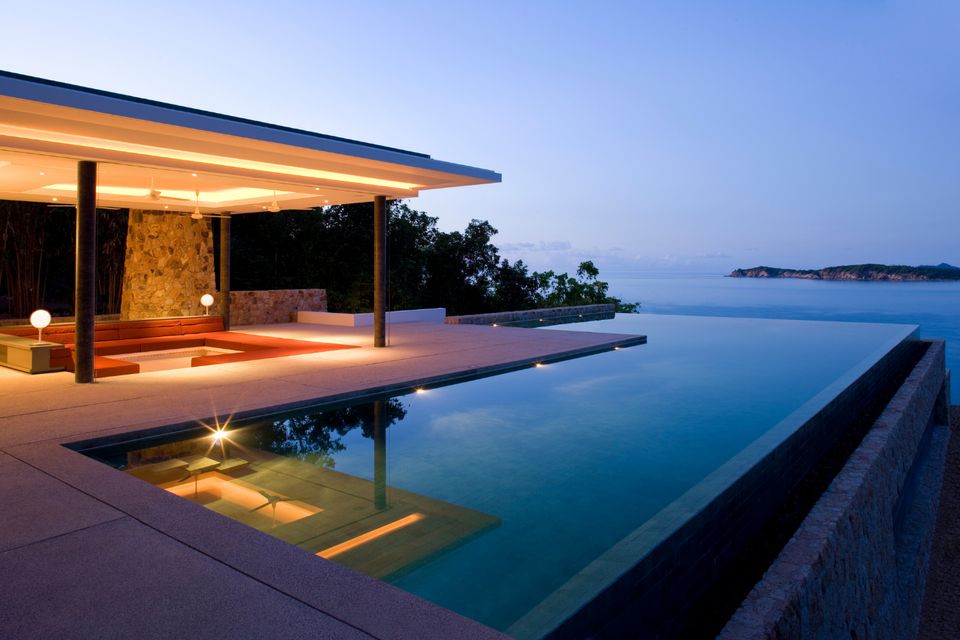 Luxury villa with an infinity pool at dusk