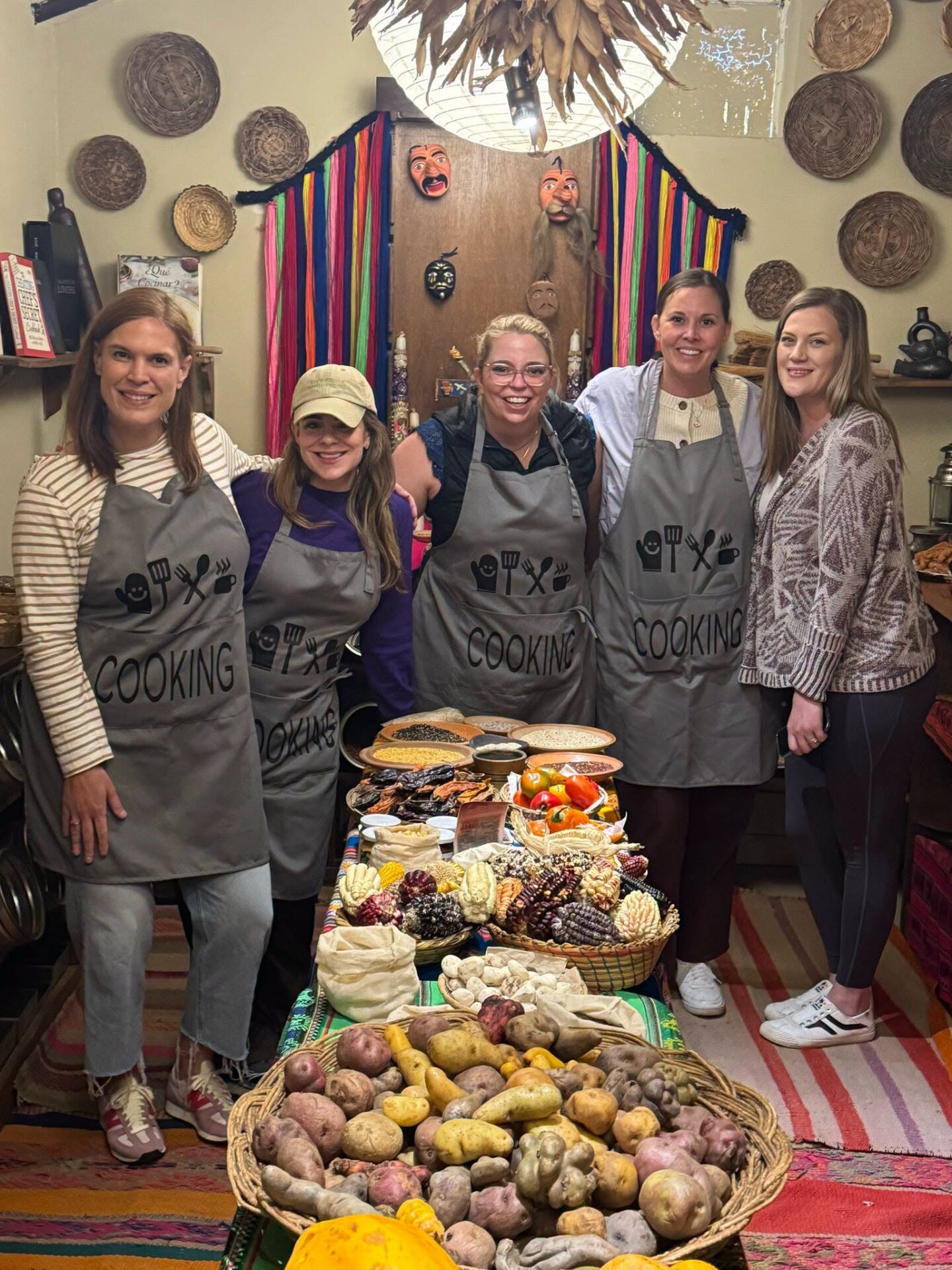 Travel Byrds team with a spread of Andean potatoes, corn and dishes at a cooking class