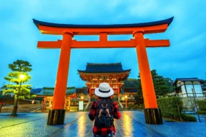 Travelers enjoying a Japan trip planned by a travel agency, with Mt. Fuji in the background