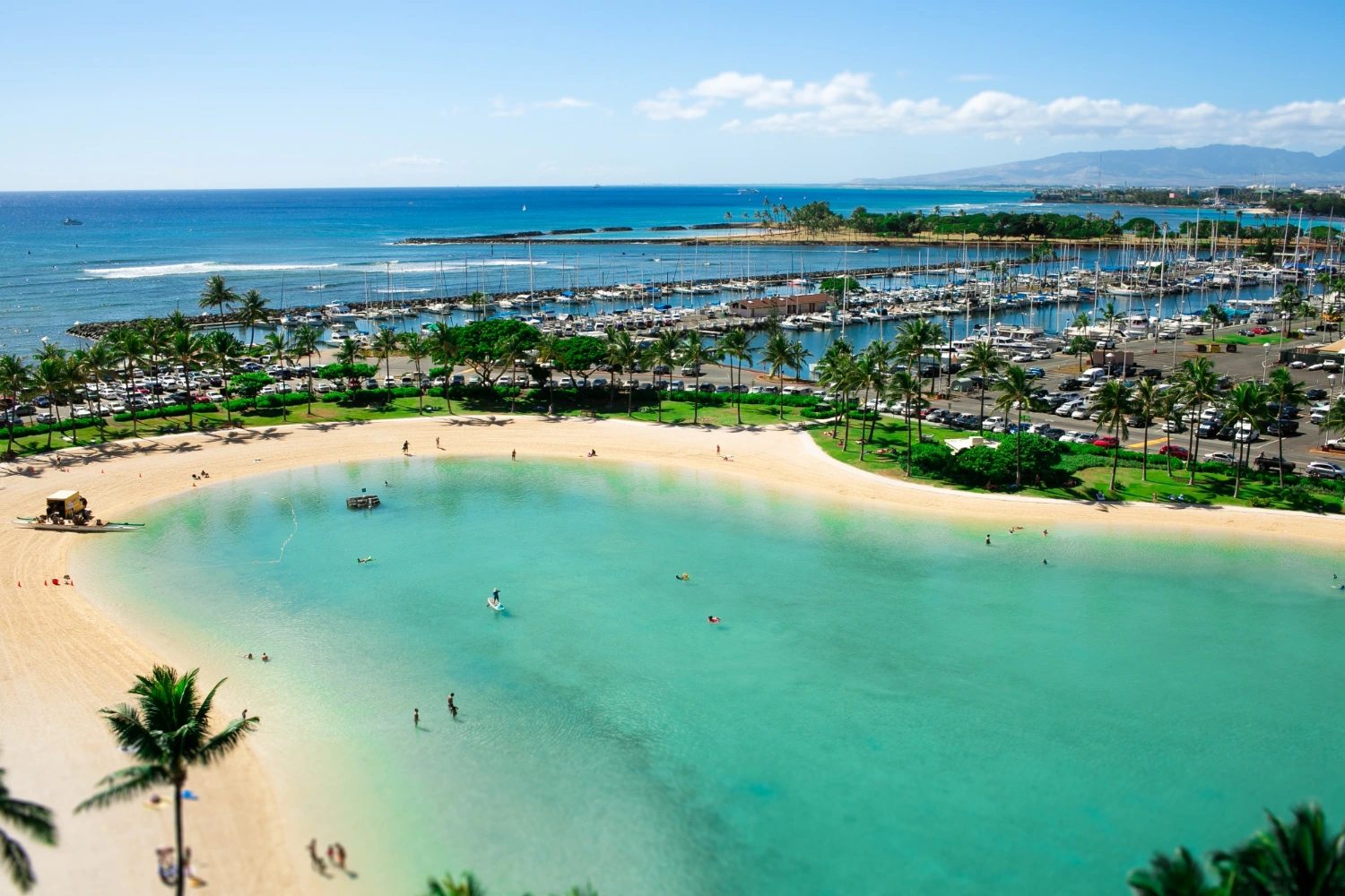 Aerial view of a public beach lined with resorts in Wailea, Maui