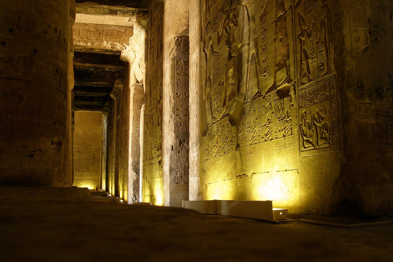 Lamp-lit columns inside the Temple of Seti I at Abydos