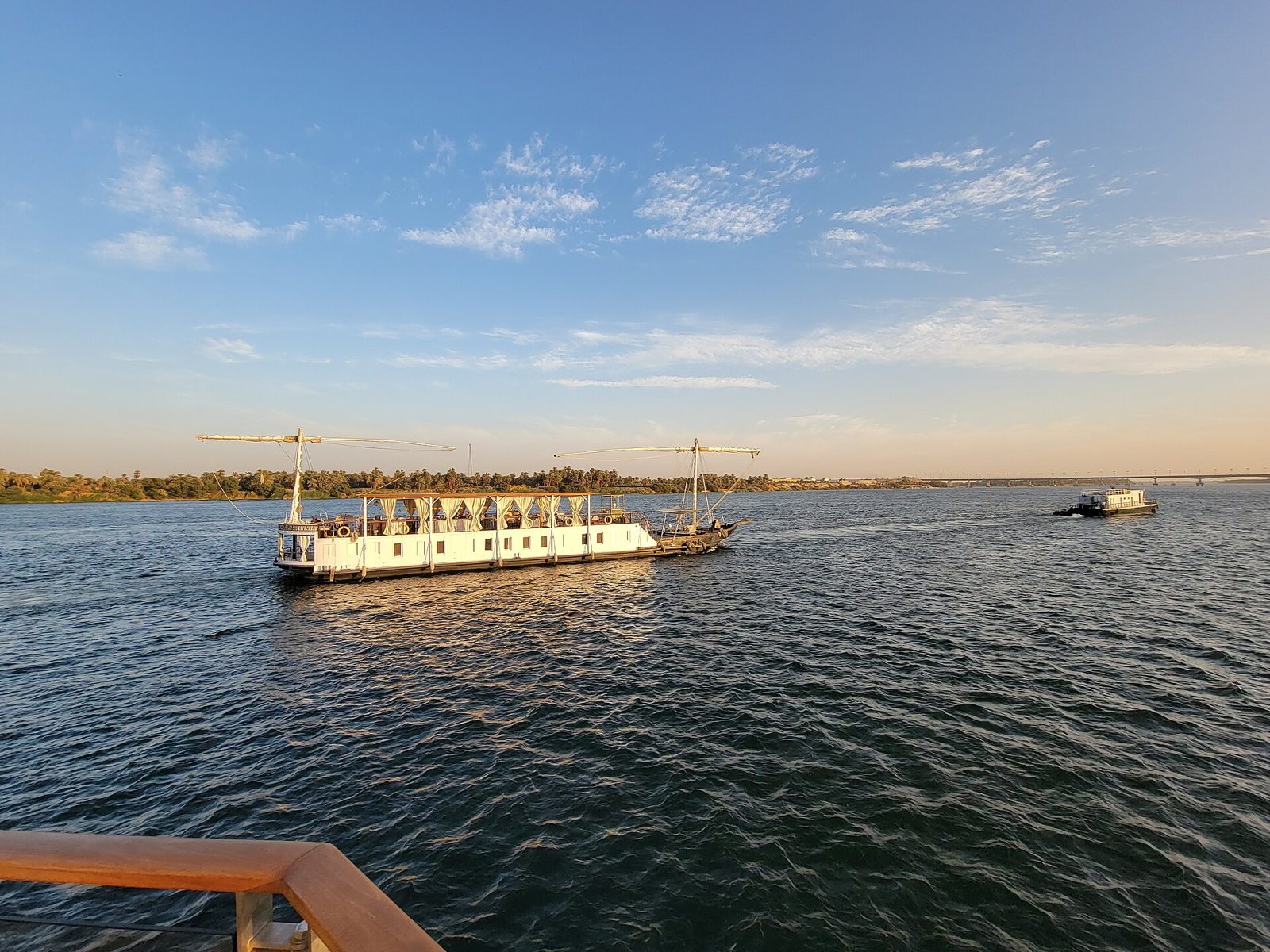 View of a dahabiya from the deck of another boat