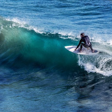 Surfer riding a wave in the ocean.